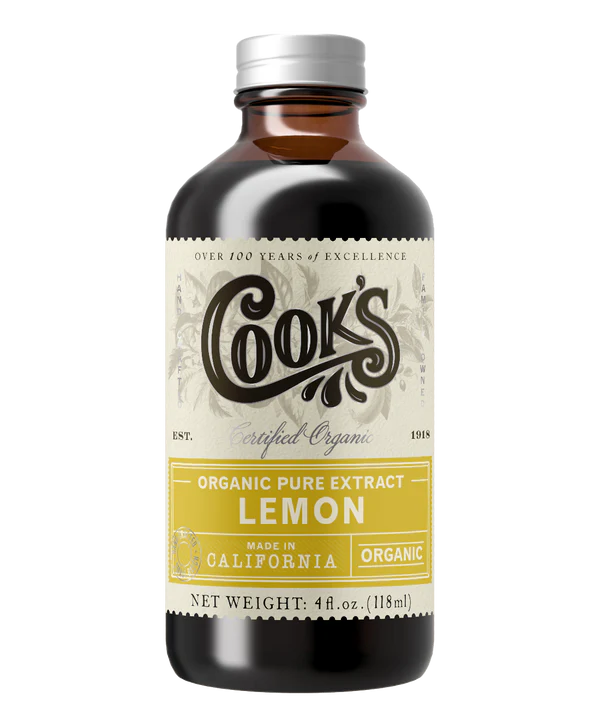 A bottle of Cook's Organic Pure Lemon Extract with a white and black label, indicating it is allergen free, certified organic, and made in California.