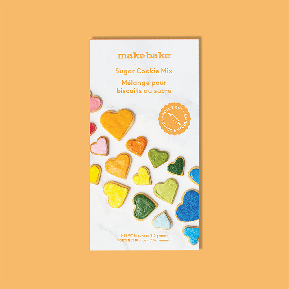Make Bake Sugar Cookie Mix packaging with colorful heart-shaped cookies on a caramel colored background