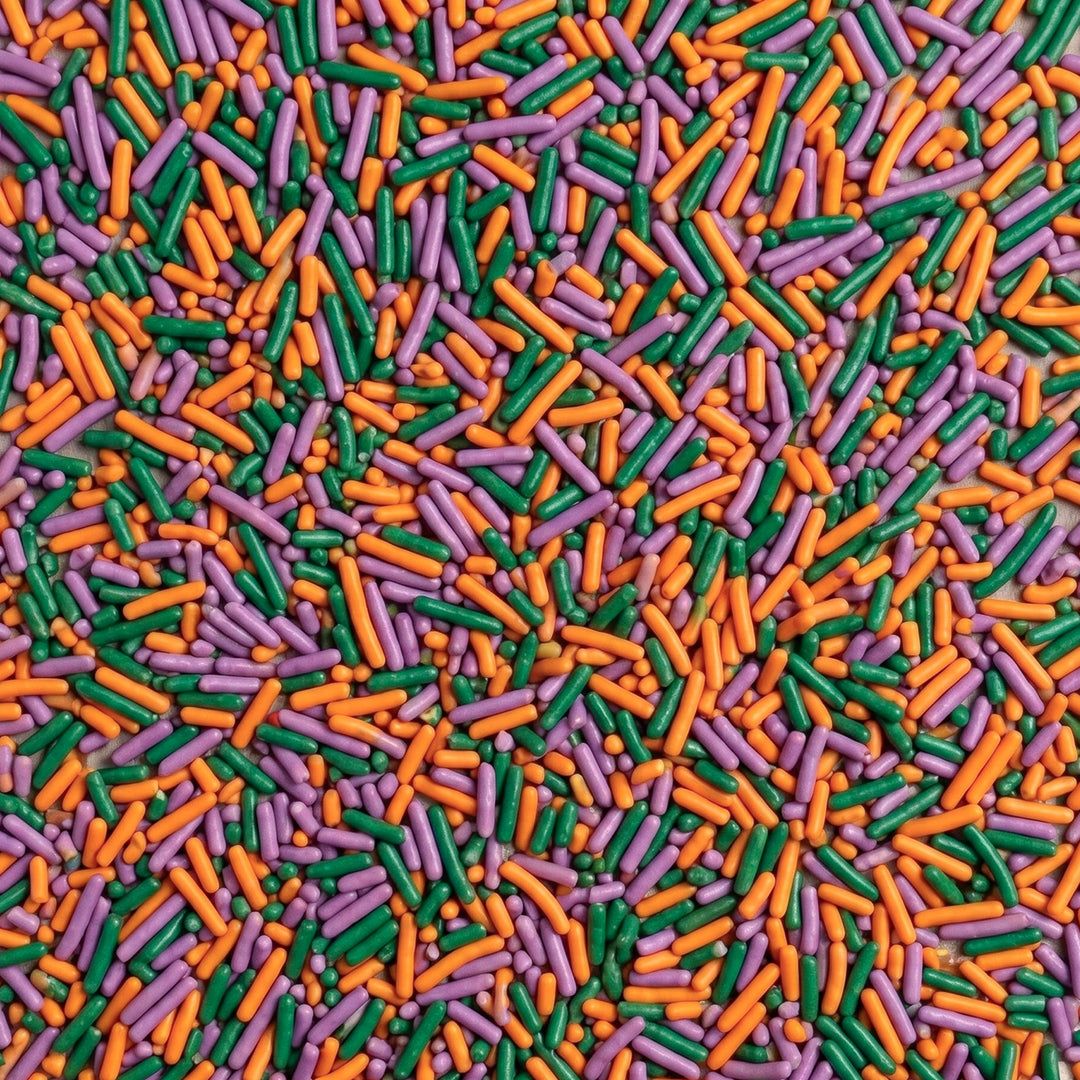 Upclose images of a colorful jimmies sprinkle mix that includes green, orange, and purple sprinkles.