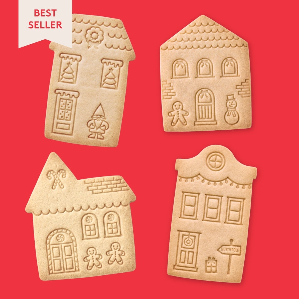 Four gingerbread house-shaped cookies with stamped designs on a red background, labeled 'Best Seller'.