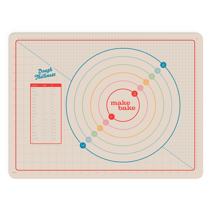 Silicone baking mat with measurements for pies and ruler in CM and inches and a dough rolling thickness chart. Mat is cream colored with colorful rainbow colors in the design.
