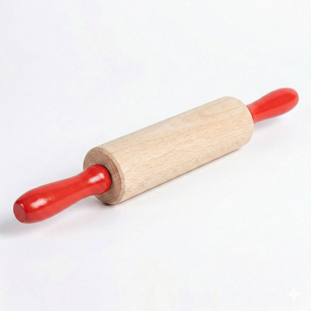 Child's wooden rolling pin with red handles on a white background.