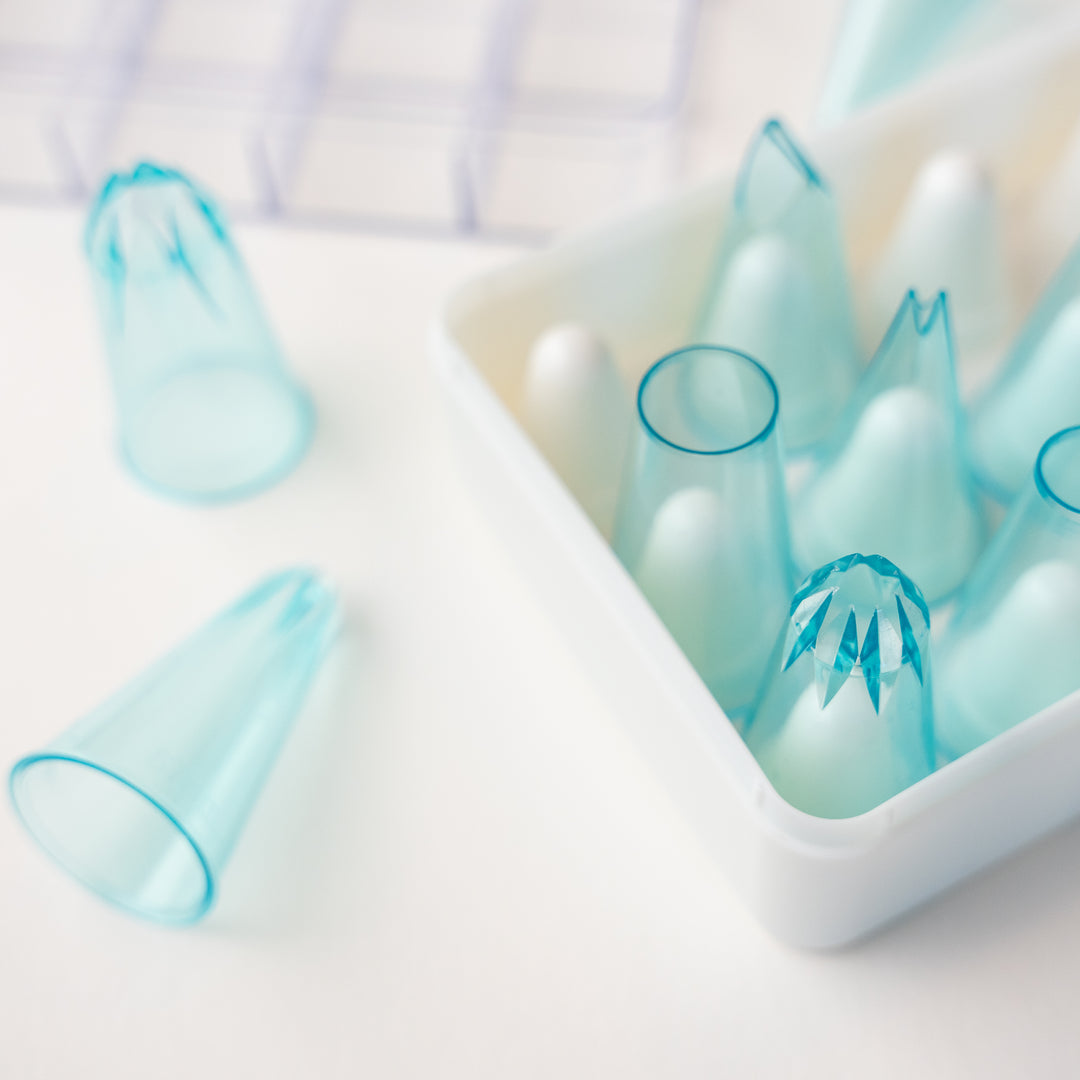 Close up of pastry piping tip set to show detail. Piping tips are clear blue.