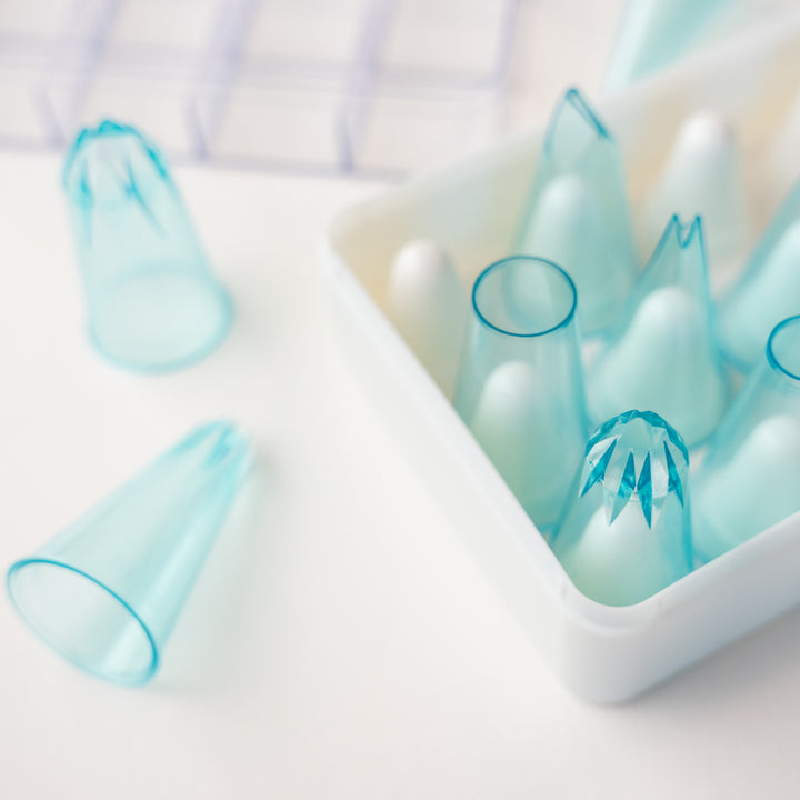 Close up of pastry piping tip set to show detail. Piping tips are clear blue.