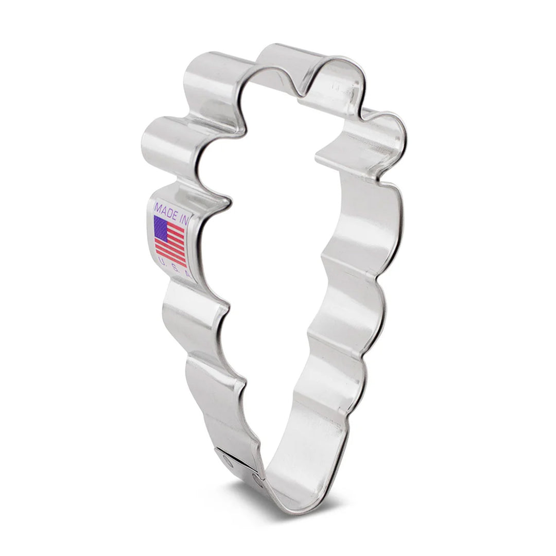 Silver cookie cutter with wavy design and 'Made in USA' label on a white background