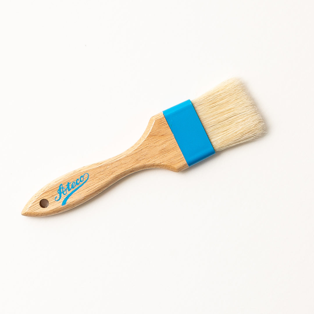 pastry brush with wooden handle on a white background