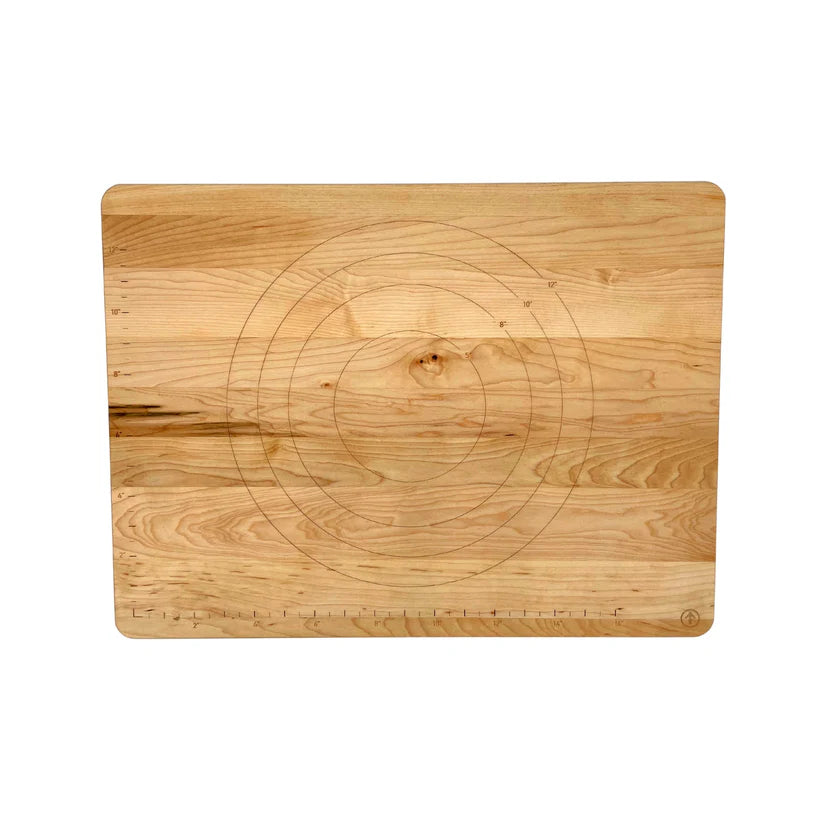 Wooden cutting board with circular design on a white background