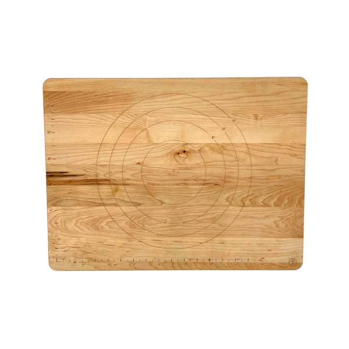 Wooden cutting board with circular design on a white background