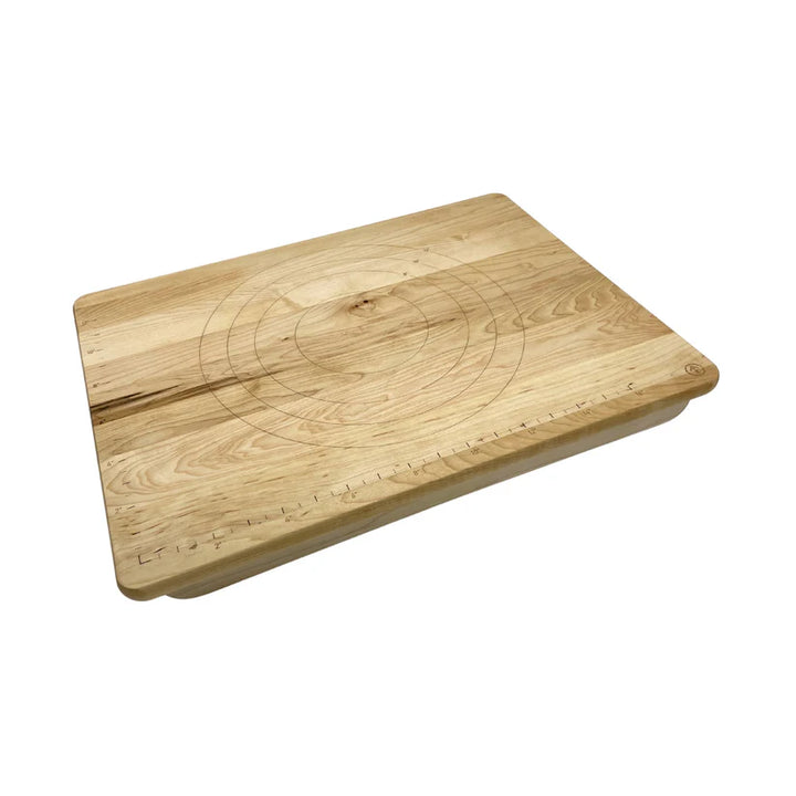 Wooden cutting board with measurement markings on a white background