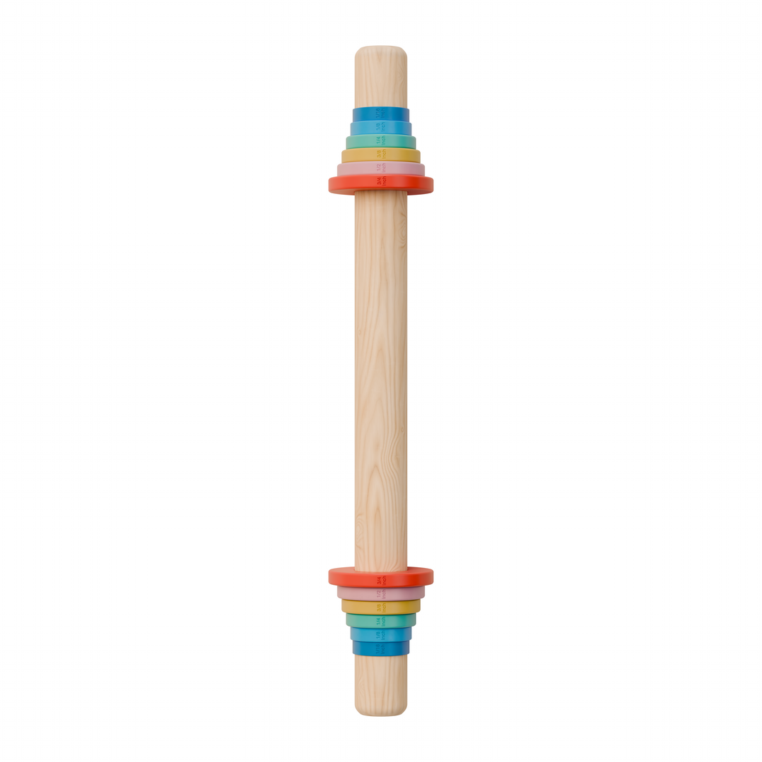 Wooden rolling pin with colorful dough thickness rings on a white background